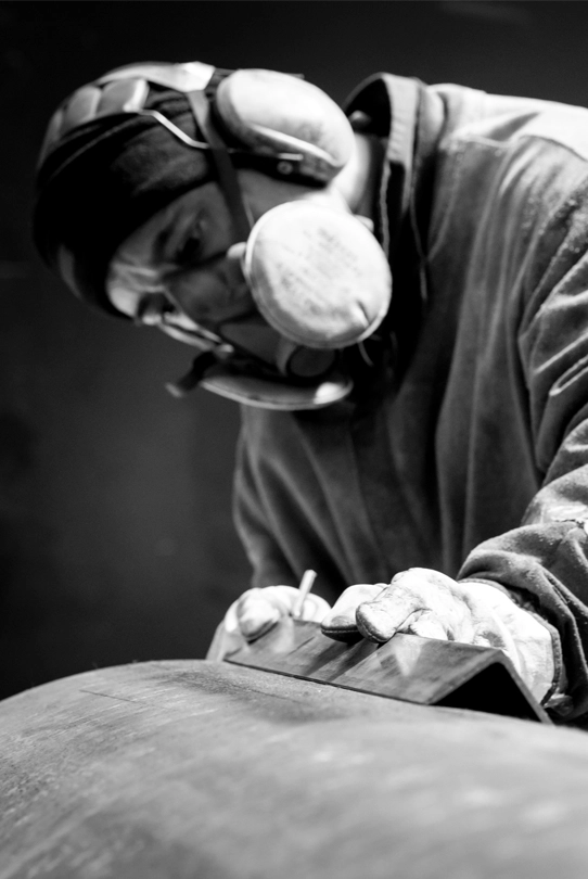 A Blocotelha worker operating machinery in the factory.